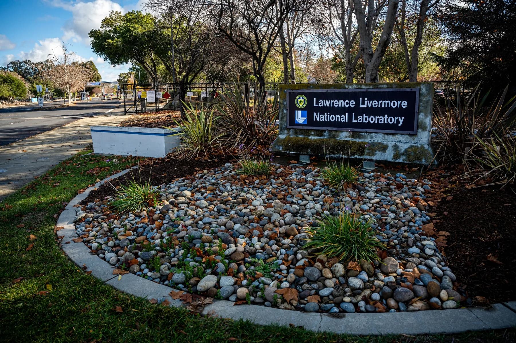 Entrance sign at Lawrence Livermore National Laboratory with rock landscaping
